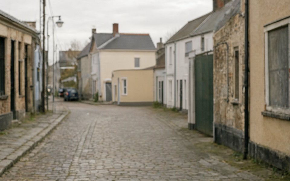 The same street with the woman removed and the cobbles filled in.
